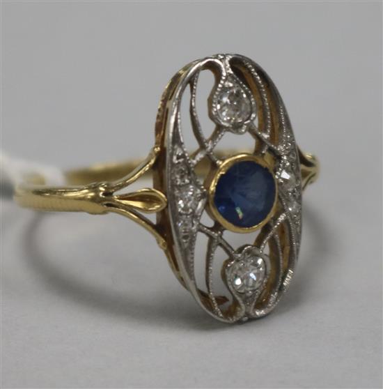 An early 20th century Art Nouveau gold, sapphire and diamond set oval dress ring, size Q.